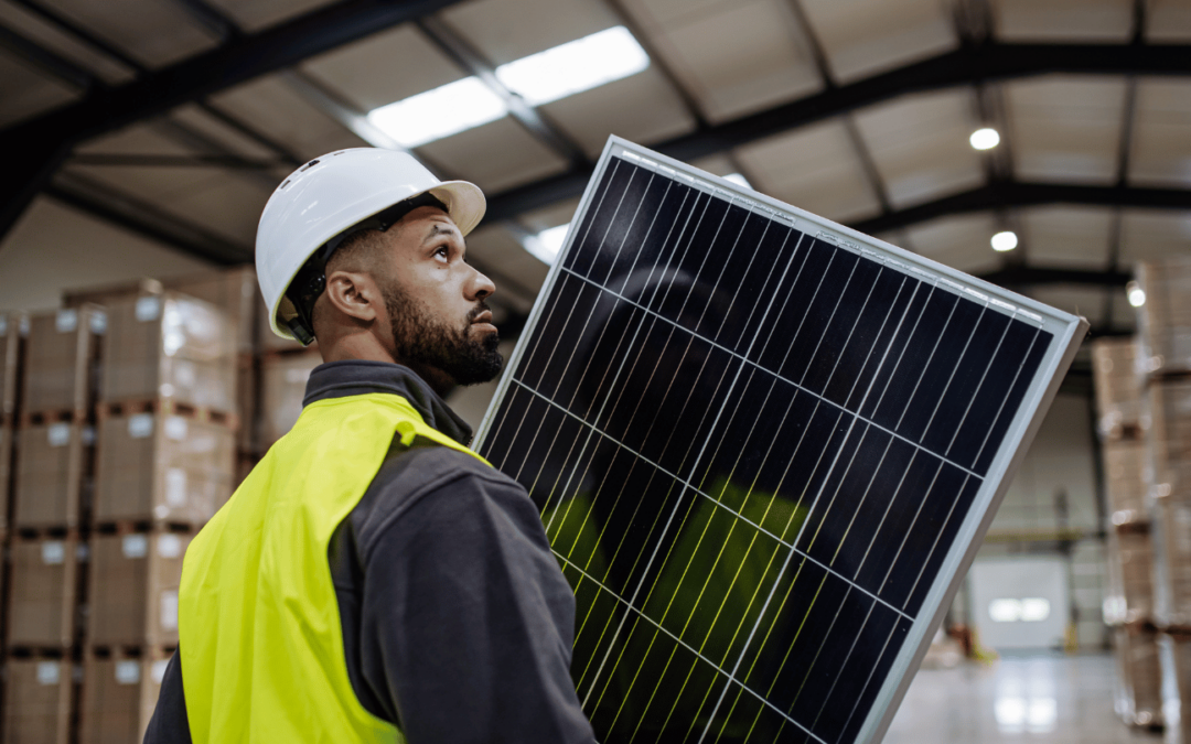a technician from repower orange installing solar panels in an orange county warehouse, highlighting local solar solutions and renewable energy expertise in southern california